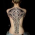 Large black ink amazing looking whole back tattoo of ancient statue