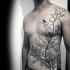 Large blackwork style chest and belly tattoo of dark forest and crow