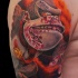 Large colored shoulder tattoo of bloody evil monkey