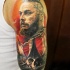 Large colorful shoulder tattoo of Viking with ship