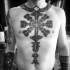 Large detailed black ink chest and belly tattoo of mystical ornament