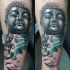 Großes im neue Schule Stil farbiges Buddhas Statue Tattoo am Unterarm mit Lotusblume