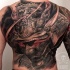 Large whole back tattoo of neo japanese style demonic helmet