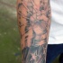 Lifelike detailed forearm tattoo of lineman worker with stars and flag