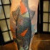 Lifelike large colored leg tattoo of fish with geometrical figures