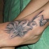 bel giglio con farfalla sexy tatuaggio disegno