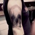 Linework black ink shoulder tattoo of human skull