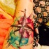 Tatuaje en el antebrazo, compás precioso de acuarelas