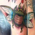 Tatuaje  de escarabajo multicolor