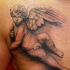BELLO CHERUBINO REALISTICO TATUAGGIO SUL PETTO