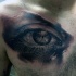 Magnificent colored chest tattoo of woman eye