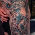 Tatuaje en el muslo,  pulpo masivo impesionante en tonos pastel