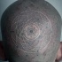Tatuaje en la cabeza, simbolo misterioso grande