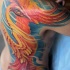 Großartiger Phönix Tattoo an Rippen