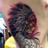 Tatuaje en el costado,  mujer india tranquila de varios colores