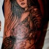 Massive accurate painted black ink shoulder tattoo of seductive geisha woman
