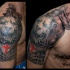 Medieval style colored shoulder tattoo of armor with lion head