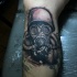Medium size 3D style black ink soldier in gas mask tattoo on leg