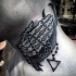Medium size black ink neck tattoo of praying skeleton hands