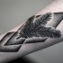 Mittelgroßes schwarzes im Punktierung Stil Unterarm Tattoo mit Baumzweig und geometrischen Figuren