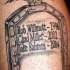 Memorial style black ink tattoo of linemen tomb stone with lettering