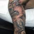 Memorial themed colored sleeve tattoo of cemetery combined with dollars