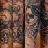 Mexican traditional colored forearm tattoo of woman portrait wit clock and rose