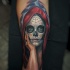 Mexican traditional detailed looking forearm tattoo of woman portrait