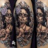 Mexican traditional style colored shoulder tattoo of woman portrait with skull and flowers