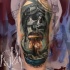 Military themed colored tattoo of nuke blast with human skull and helmet
