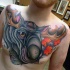 Modern school style colored funny elk tattoo on chest with maple leaves