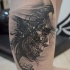 Modern style black and white leg tattoo of demonic old man portrait