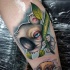 Modern style colored leg tattoo of little fantasy bear
