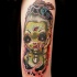 Modern style forearm tattoo of zombie doll