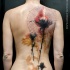 Modern style multicolored whole back tattoo of beautiful wildflowers