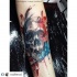 Modern traditional style colored arm tattoo of big skull with flowers and butterfly