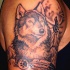 Tatuaggio carino sul braccio il lupo & la luna