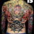 Multicolored creepy looking back tattoo of creepy monsters with skull