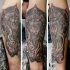 Mysterious black ink forearm tattoo of lion with ancient sculpture and flower