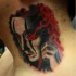 Mystical black and white neck tattoo of demonic mask
