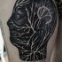 Mystical black ink human head with ornaments tattoo stylized with lettering