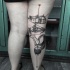 Mystical looking colored leg tattoo of little boy with house and flower