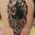 Mystical looking colored thigh tattoo of mystical picture with knifes and wings