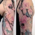 Natural looking colored beautiful underwater flowers with squid and lettering tattoo