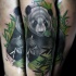 Natural looking colored tattoo of big eating panda bear