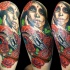 Natural looking colored tattoo of woman with old pistol and roses