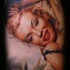 Tatuaje en el hombro, Marilyn Monroe sonriente traviesa