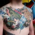 Nautical style colored nautical tattoo on chest with anchor and shark
