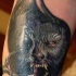Neo traditionelles farbiges Werwolf Tattoo am Arm
