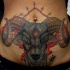 Neo traditional style colored belly tattoo of demonic goat with crosses